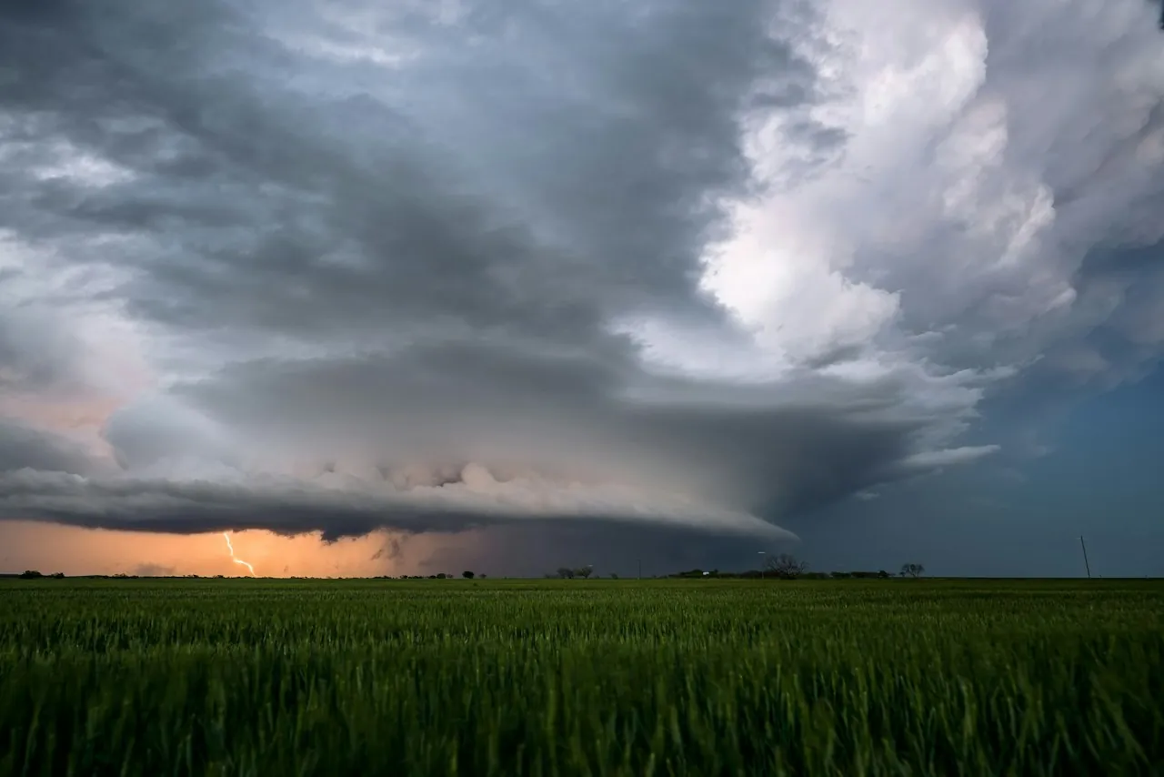 Roof Replacement in Sherman — a rotating storm cloud over green fields